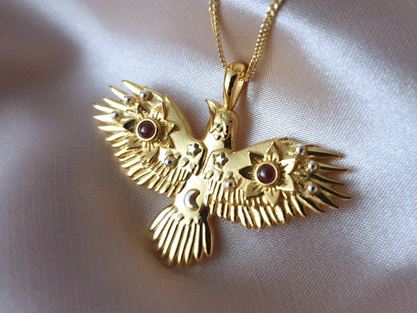 Gold Flying Crow Necklace with Garnets