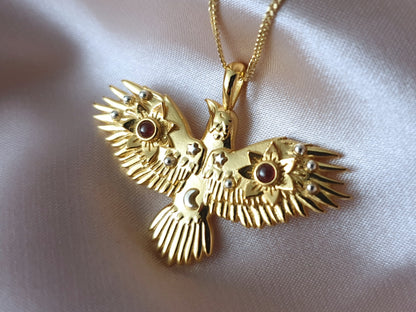 Gold Flying Crow Necklace with Garnets