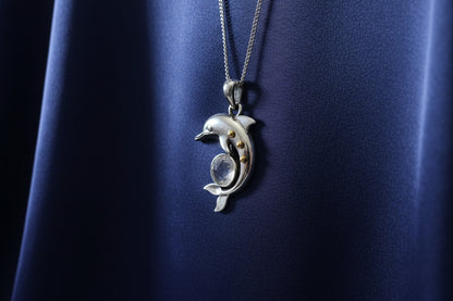 Silver dolphin pendant with moonstone